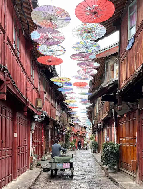 A Photographic Journey Through Rural Yunnan lijiang road with umbrellas