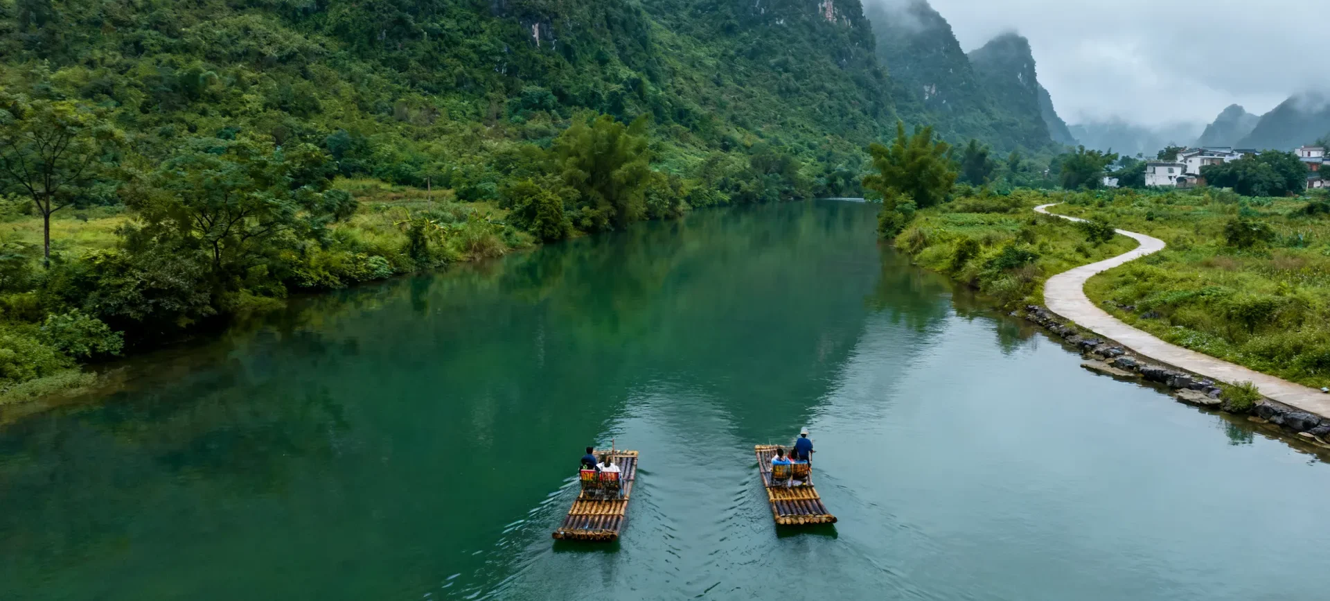 Discover Li River Guilin To Yangshuo & Beyond! bamboo rafting two rafts 2 e1767923148128