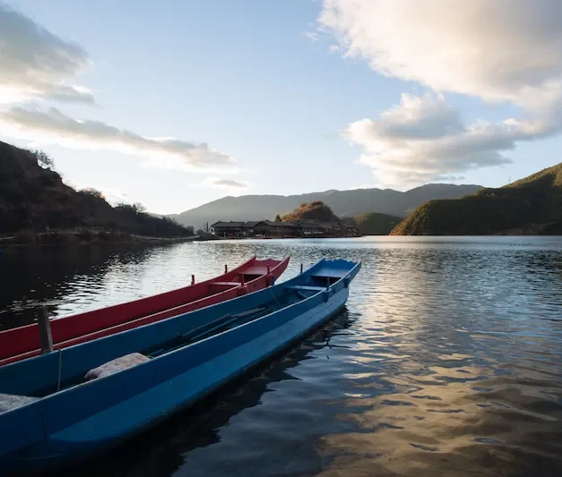 Lijiang Old Town To Lugu Lake: The Mosuo Trail traditional boats lugu lake 1 e1767873212143