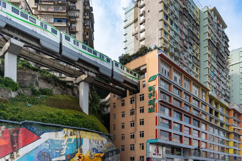 China Contrasts | 10-Day Private China Itinerary liziba train into building chongqing