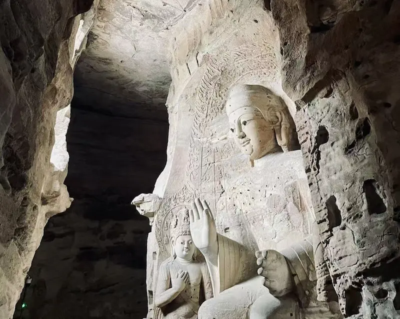 Datong Travel Guide: Yungang Grottoes & Beyond buddha emerging from stone yungang